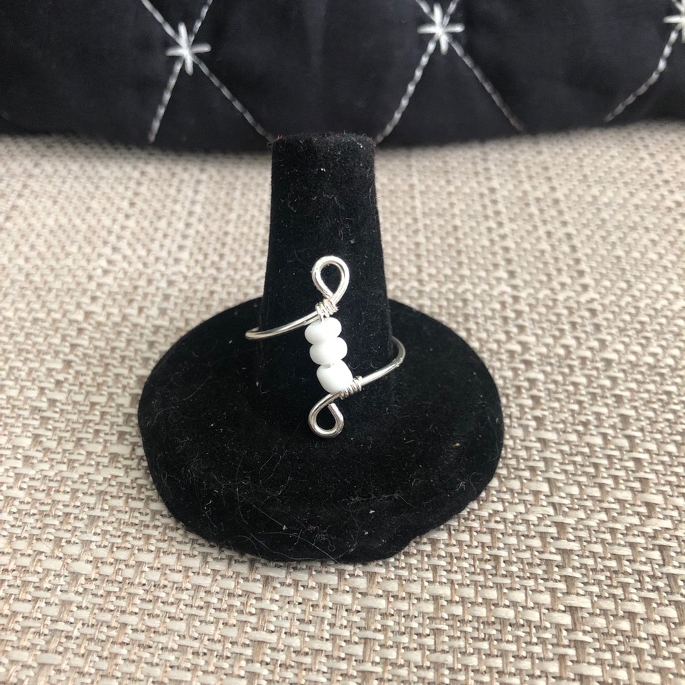 Homemade ring with White beads.